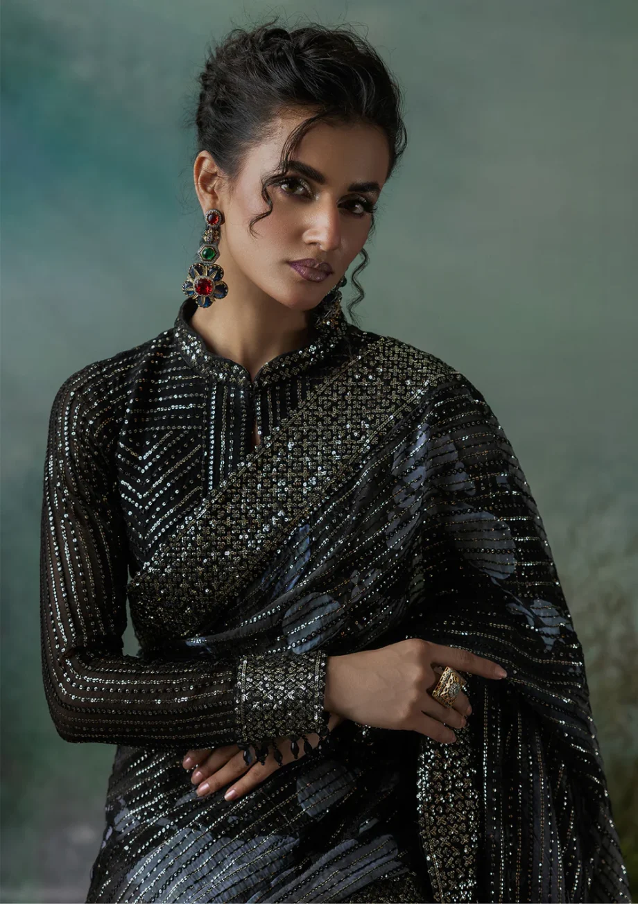 Close-up of intricate sequin work on a saree.